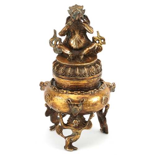 1399 - Chinese gilt bronze tripod incense burner with figural lid, 21cm high