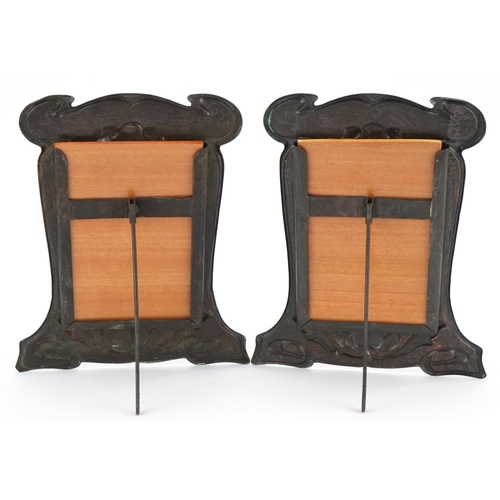 122 - Pair of Art Nouveau beaten copper easel photo frames embossed with stylised floral motifs, each 24.5... 