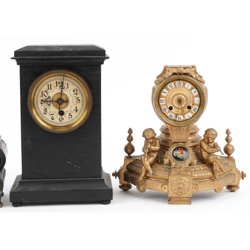 2697 - Three 19th century mantle clocks and an ornate case, the clocks comprising a gilt metal example surm... 