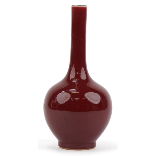 40 - Chinese porcelain long neck bottle vase having a sang de boeuf glaze, six figure character marks to ... 