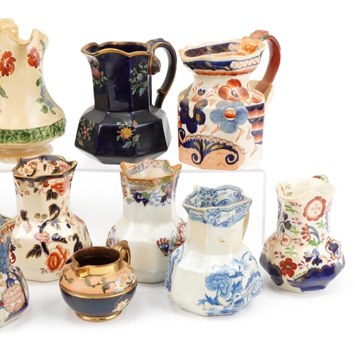 314 - Early 19th century and later jugs including an example hand painted with flowers, cobalt blue glazed... 