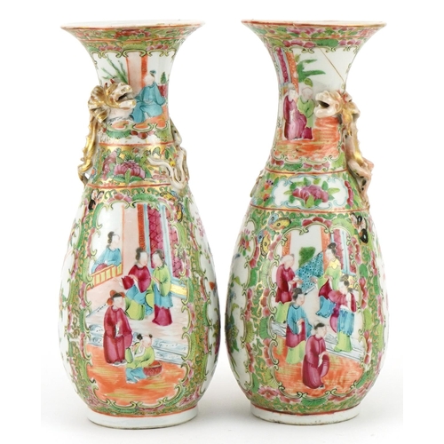 153 - Pair of Chinese Canton porcelain vases, each decorated in relief with a dragon, each hand painted in... 