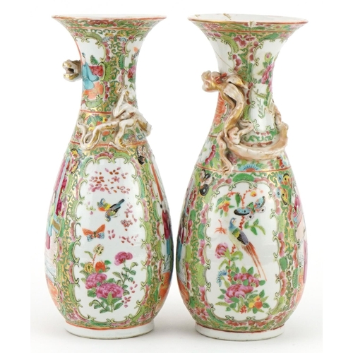 153 - Pair of Chinese Canton porcelain vases, each decorated in relief with a dragon, each hand painted in... 