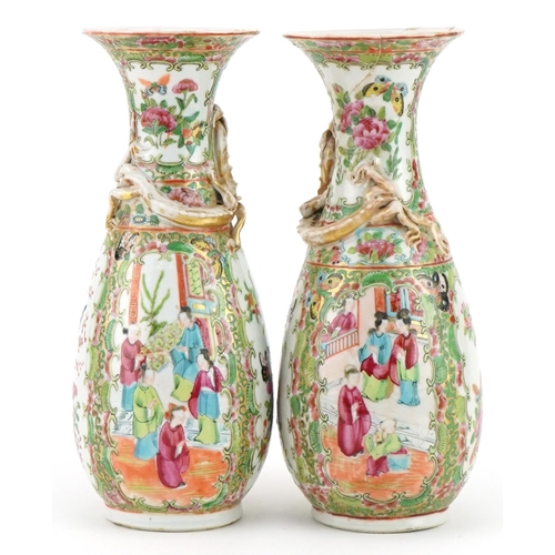 153 - Pair of Chinese Canton porcelain vases, each decorated in relief with a dragon, each hand painted in... 