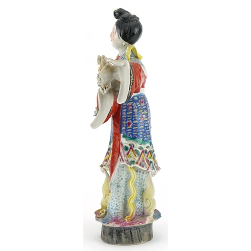 200 - Chinese porcelain statuette of an empress holding flowers hand painted in the famille rose palette, ... 