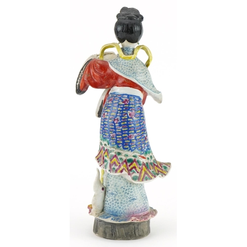 200 - Chinese porcelain statuette of an empress holding flowers hand painted in the famille rose palette, ... 