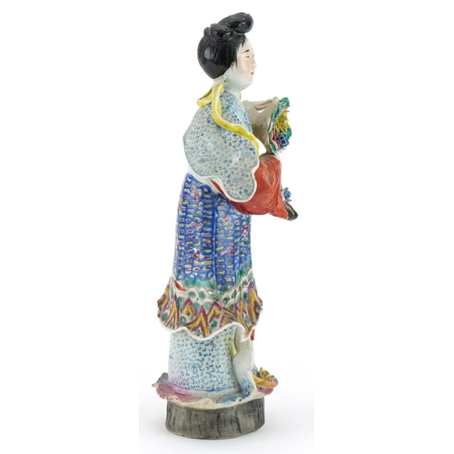 200 - Chinese porcelain statuette of an empress holding flowers hand painted in the famille rose palette, ... 