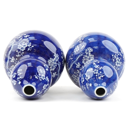 618 - Pair of Chinese blue and white porcelain double gourd vases hand painted with prunus flowers, blue r... 