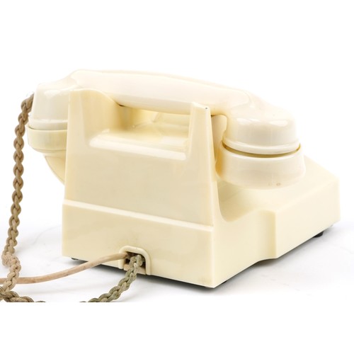 564 - Vintage pyramid style cream Bakelite dial telephone, 20cm in length