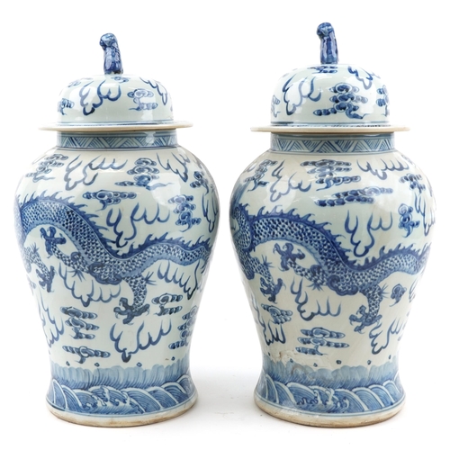 103 - Large pair of Chinese blue and white porcelain baluster vases and covers hand painted with dragons c... 