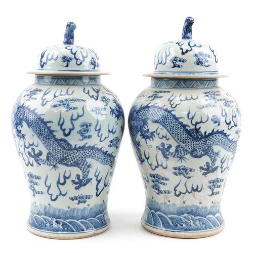 103 - Large pair of Chinese blue and white porcelain baluster vases and covers hand painted with dragons c... 