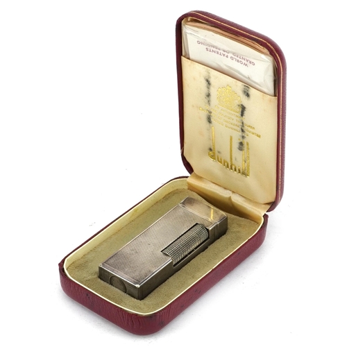 343 - Dunhill, silver plated pocket lighter with engine turned case and box, 6.5cm high