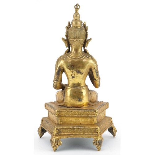 105 - Chino Tibetan jewelled gilt bronze figure of seated Buddha, 24cm high