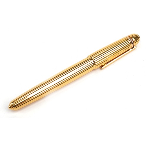 128 - Cartier Pasha gold plated fountain pen set with a blue cabochon having an 18k gold nib dated 1989, s... 