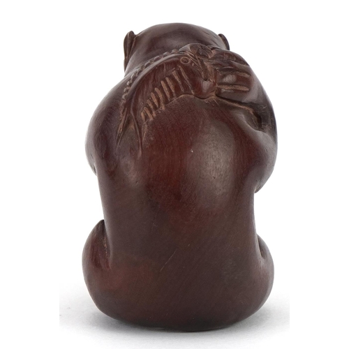 682 - Japanese carved wood okimono in the form of a monkey, character marks to the base, 4cm high