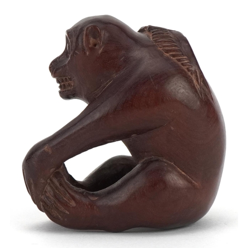 682 - Japanese carved wood okimono in the form of a monkey, character marks to the base, 4cm high