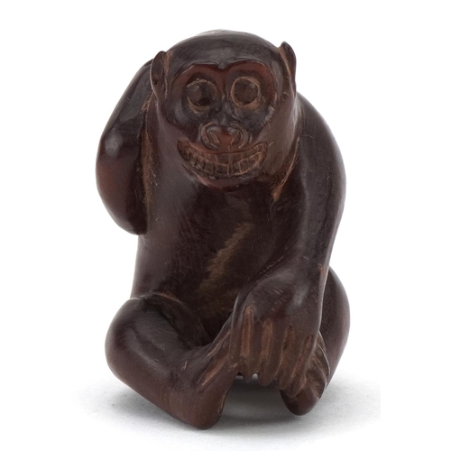 682 - Japanese carved wood okimono in the form of a monkey, character marks to the base, 4cm high