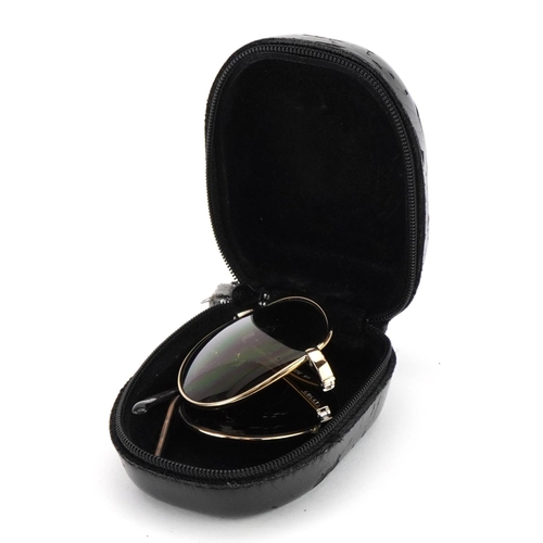 391 - Pair of ladies Gucci foldable sunglasses with case