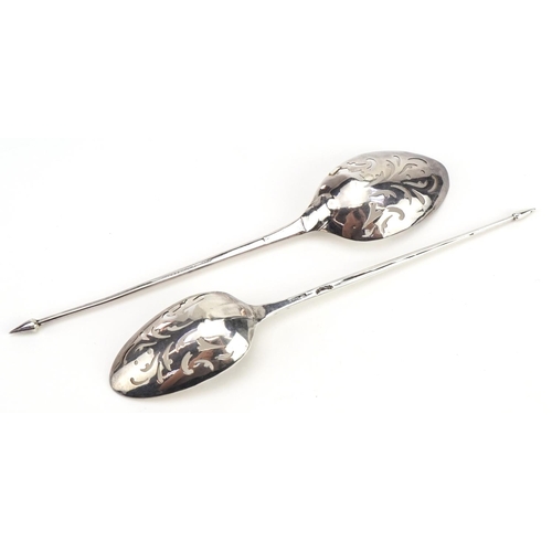 56 - Two 18th century silver mote spoons, each with pierced scroll decoration to the bowls, each indistin... 