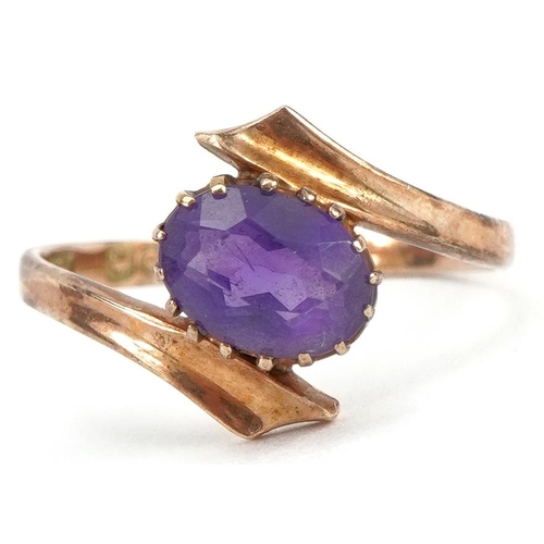 2270 - 9ct gold amethyst crossover ring, the amethyst approximately 7.6mm x 5.2mm, size K, 1.6g