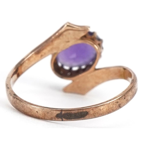 2270 - 9ct gold amethyst crossover ring, the amethyst approximately 7.6mm x 5.2mm, size K, 1.6g