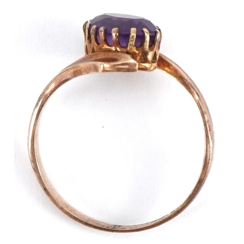 2270 - 9ct gold amethyst crossover ring, the amethyst approximately 7.6mm x 5.2mm, size K, 1.6g