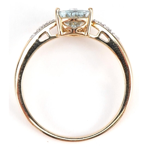 2280 - 10k gold aquamarine ring with diamond shoulders, the aquamarine approximately 8.7mm x 6.9mm, size T/... 