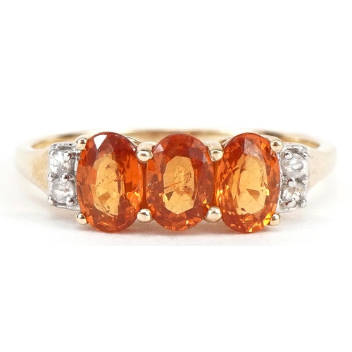 2245 - 10k gold citrine ring with clear stone shoulders, each citrine approximately 5.8mm x 3.9mm, size P, ... 