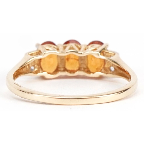 2245 - 10k gold citrine ring with clear stone shoulders, each citrine approximately 5.8mm x 3.9mm, size P, ... 