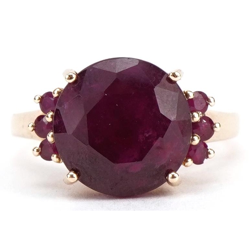 2018 - 10k gold ruby seven stone ring, the largest ruby approximately 12mm in diameter, size P, 4.8g