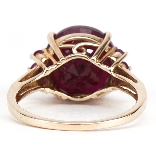 2018 - 10k gold ruby seven stone ring, the largest ruby approximately 12mm in diameter, size P, 4.8g