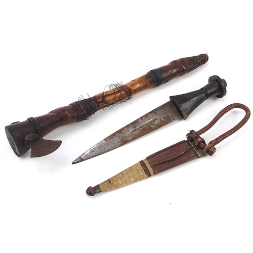 303 - Tribal interest tomahawk with carved bone figural handle and a hunting knife with leather sheath and... 