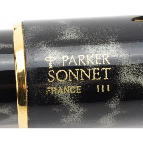 245 - Two Parker pens comprising a marbleised Sonnet and a black fountain pen with 18ct gold nib, possibly... 