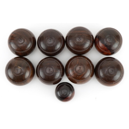 93 - Set of eight lignum vitae bowls with marker, each bowl approximately 4.5cm in diameter