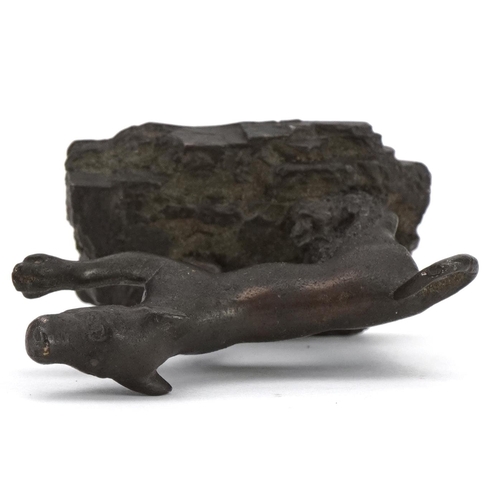 160 - Antique patinated bronze dog on later base, possibly Roman, 5.5cm in length