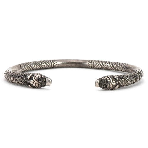 284 - Antique North Indian or Himalayan unmarked silver Makara head bangle, 7.5cm wide, 41.5g