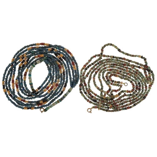 162 - Two ancient Egyptian faience four strand bead necklaces, the largest 64cm in length