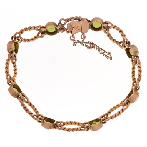 2021 - 9ct gold green stone rope twist bracelet with safety chain, possibly green amethyst, 13.6g