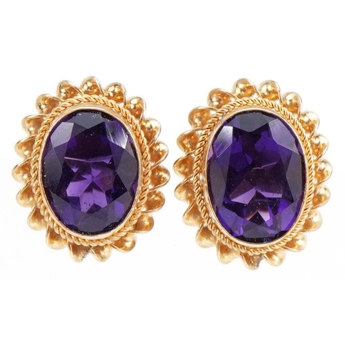 2265 - Pair of 9ct gold amethyst stud earrings, 1.2cm high, 1.7g