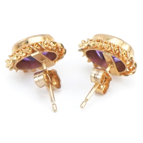 2265 - Pair of 9ct gold amethyst stud earrings, 1.2cm high, 1.7g