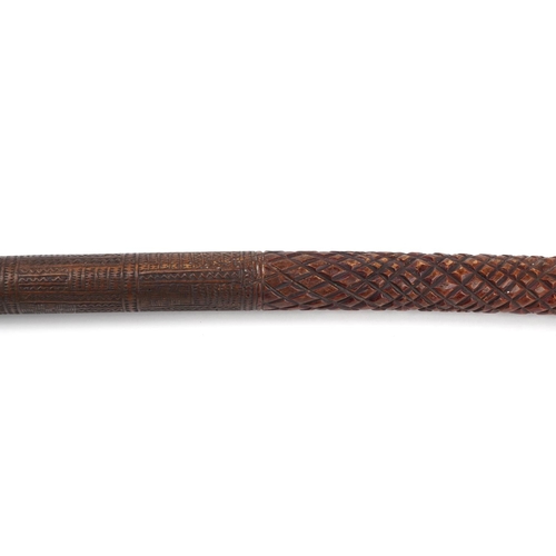 299 - Tribal interest Polynesian club carved with geometric motifs, 90cm in length