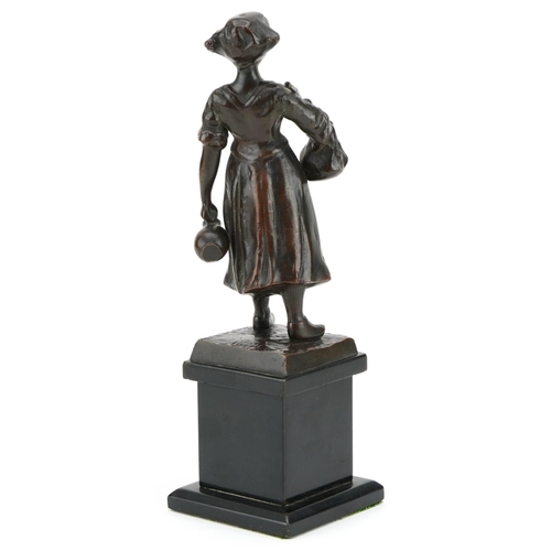 329 - After Anton Nagel, early 20th century bronze figure of a German peasant girl holding a jug and sack,... 