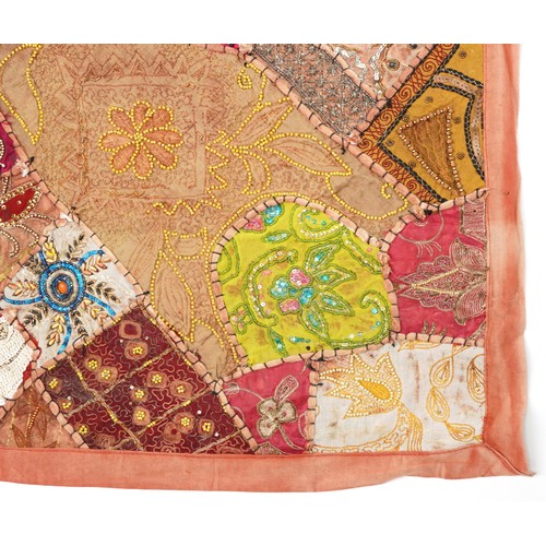 307 - Pair of Indian wall hanging textiles embellished with sequins and beads, each 145cm x 105cm