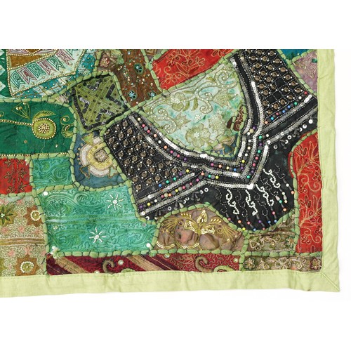 307 - Pair of Indian wall hanging textiles embellished with sequins and beads, each 145cm x 105cm