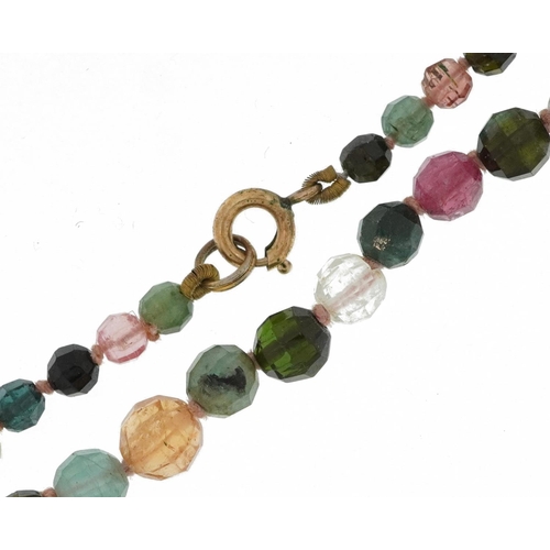 2269 - Single strand graduated bead necklace set with various stones including tourmaline and rose quartz, ... 