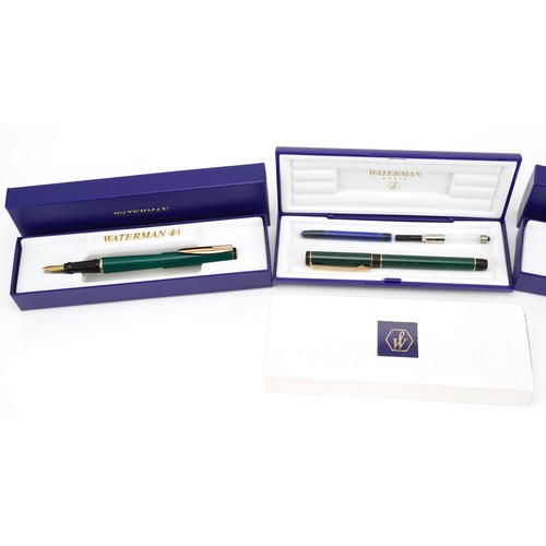 243 - Four Waterman fountain pens with fitted cases including an as new Centurion purple example