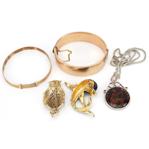 13 - Vintage and later jewellery including two 9ct gold metal core bangles engraved with foliage, enamell... 