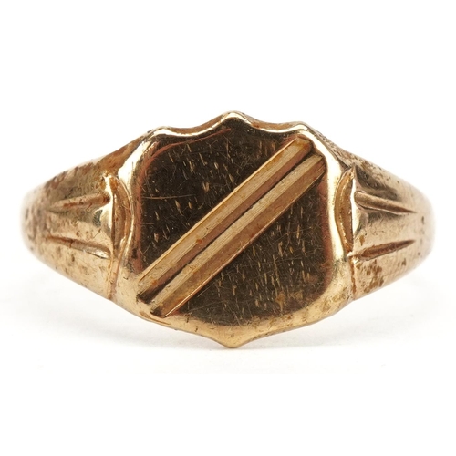 57 - 9ct gold shield shaped signet ring, size X, 4.2g