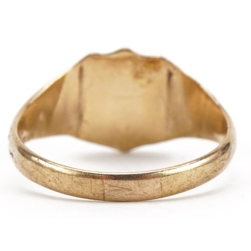 57 - 9ct gold shield shaped signet ring, size X, 4.2g