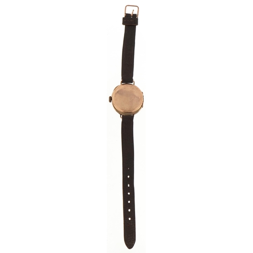 58 - 9ct gold wristwatch with enamelled dial and leather strap, 26mm in diameter, total weight 18.0g